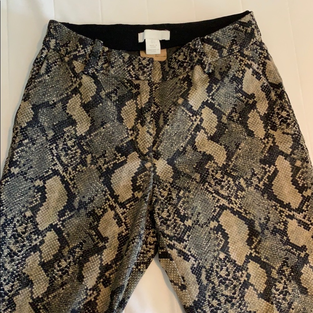 Green snake skin pattern pants.